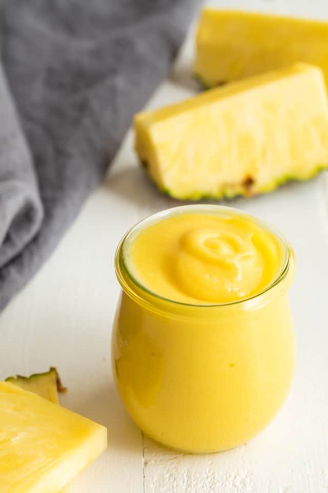 Side view of pineapple curd in a jar