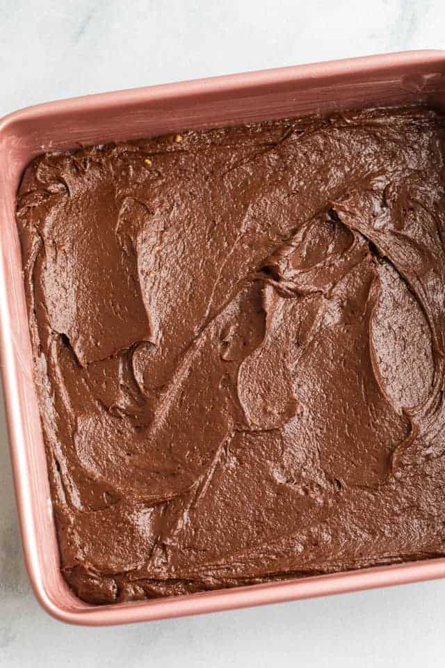 Vegan brownie batter in pink pan
