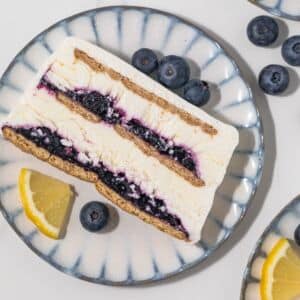 Overhead slice of blueberry lemon icebox cake on a plate.
