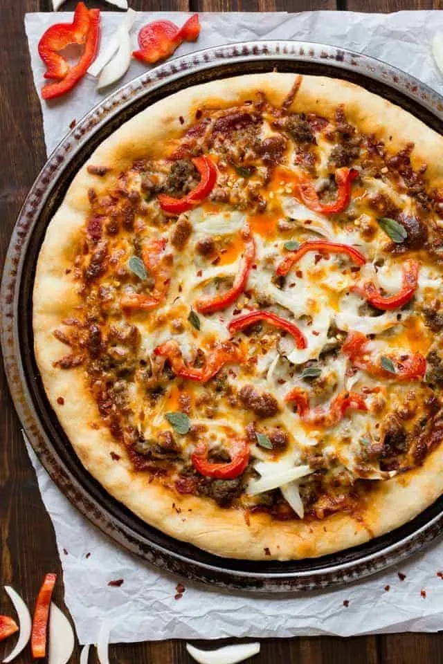 Spicy Sausage Pizza on a round pizza pan.