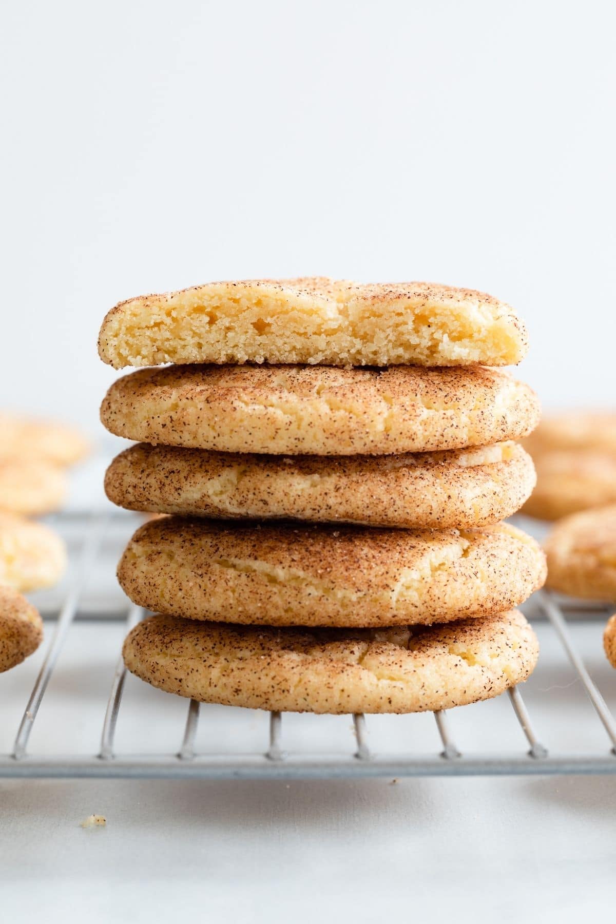 stack of snickerdoodle cookies on a wire rack
