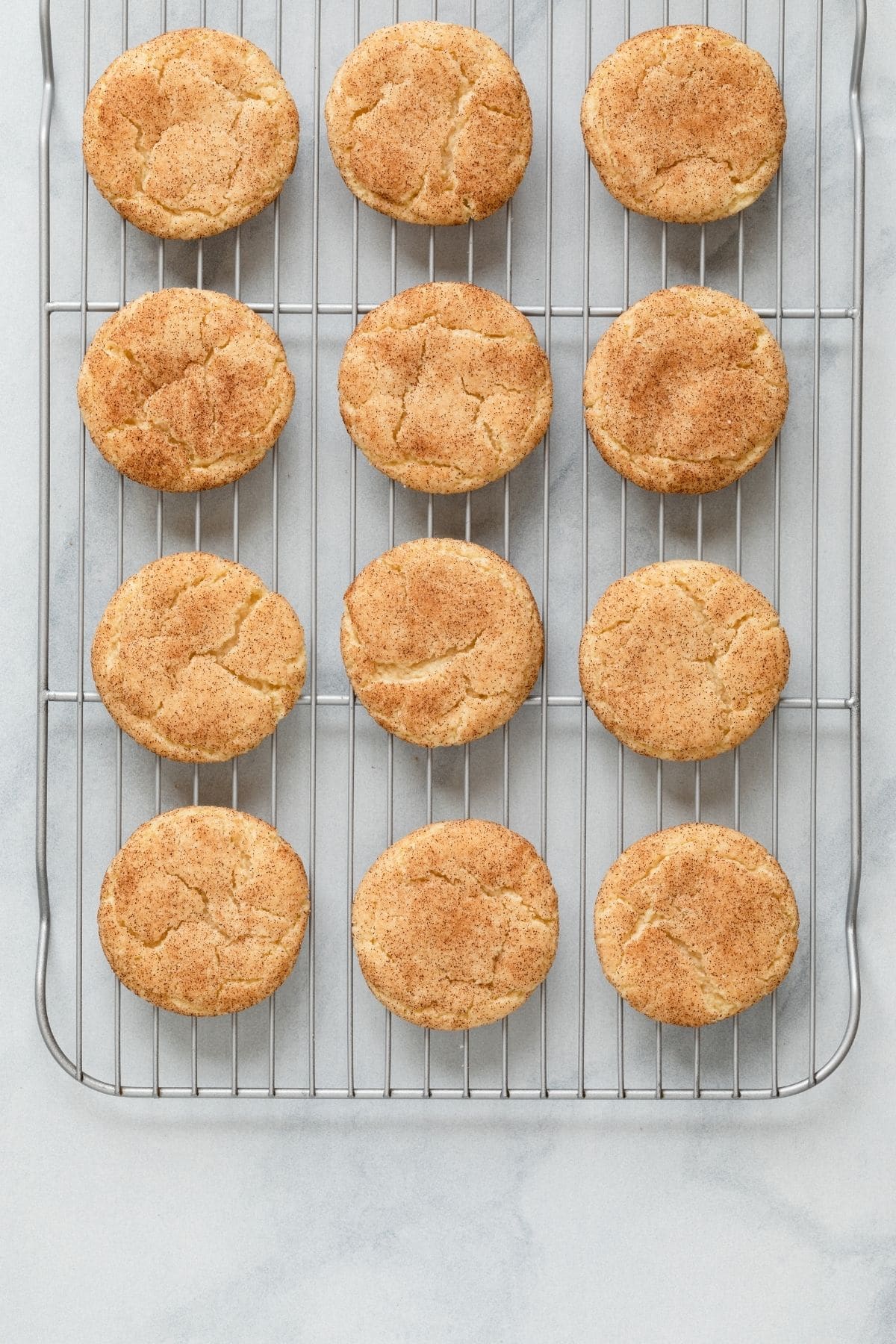 overhead of snickerdoodle cookies on wire rack