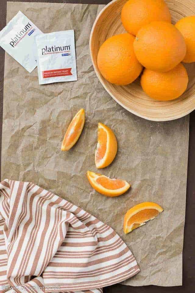 oranges and yeast packets on brown paper