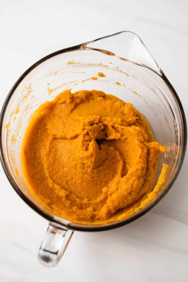 Mashed sweet potatoes in a mixing bowl