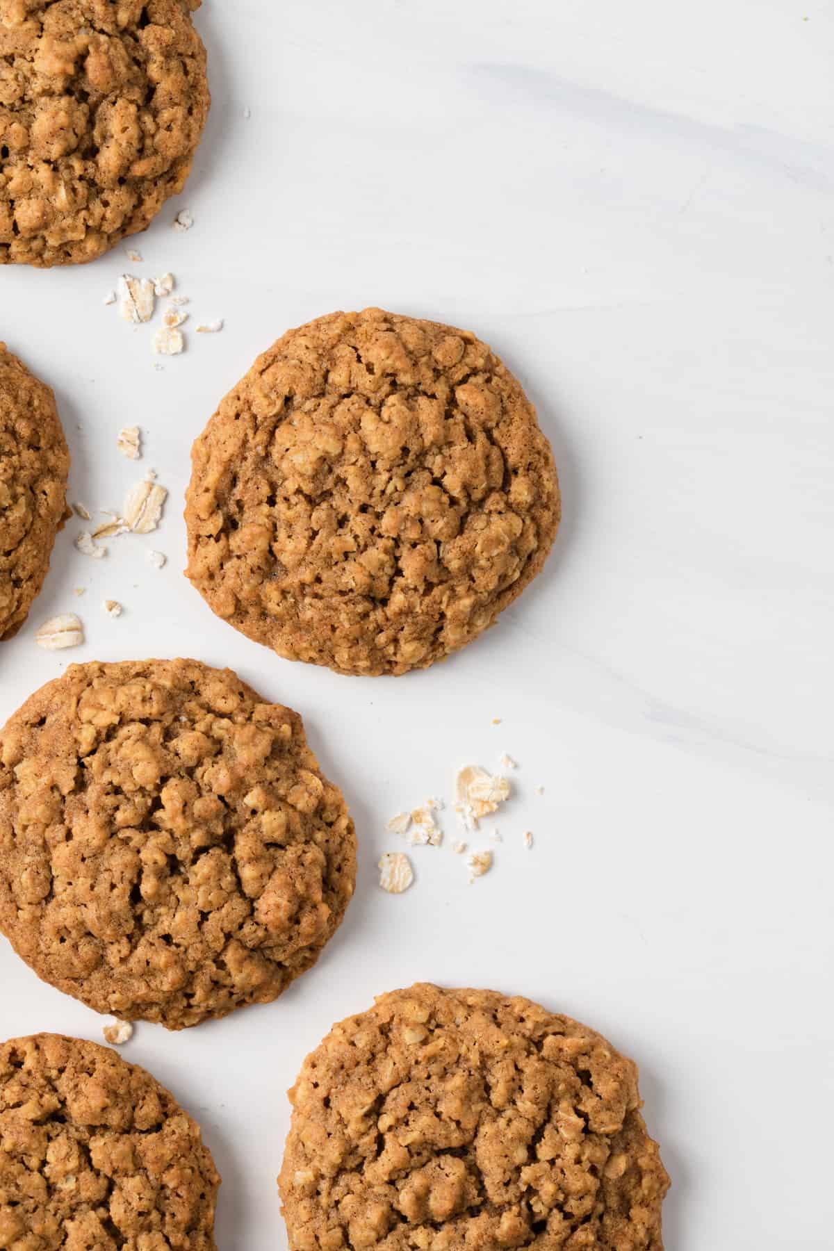 Overhead of pumpkin oatmeal cookies on white background