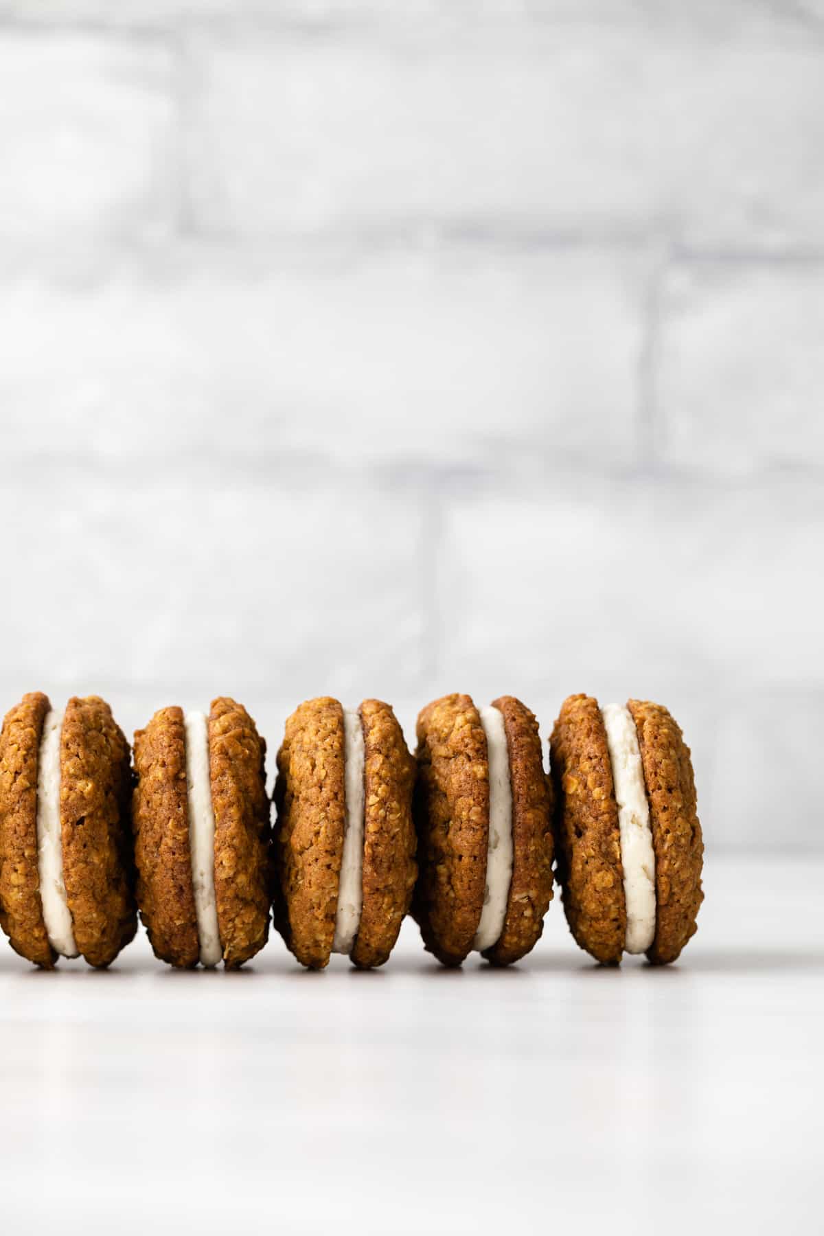 Five pumpkin oatmeal creme pies on their sides