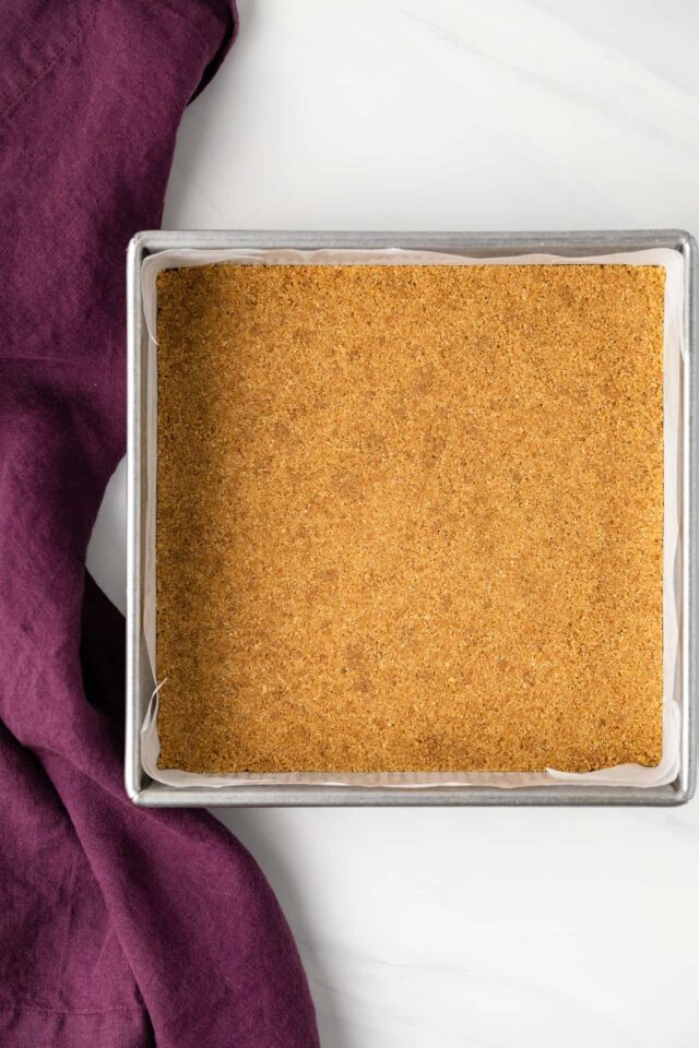 Graham cracker crust in a square pan