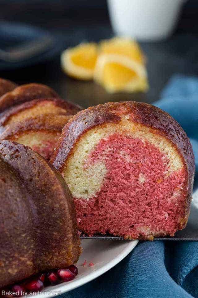 Close up view of a slice of tequila sunrise cake.