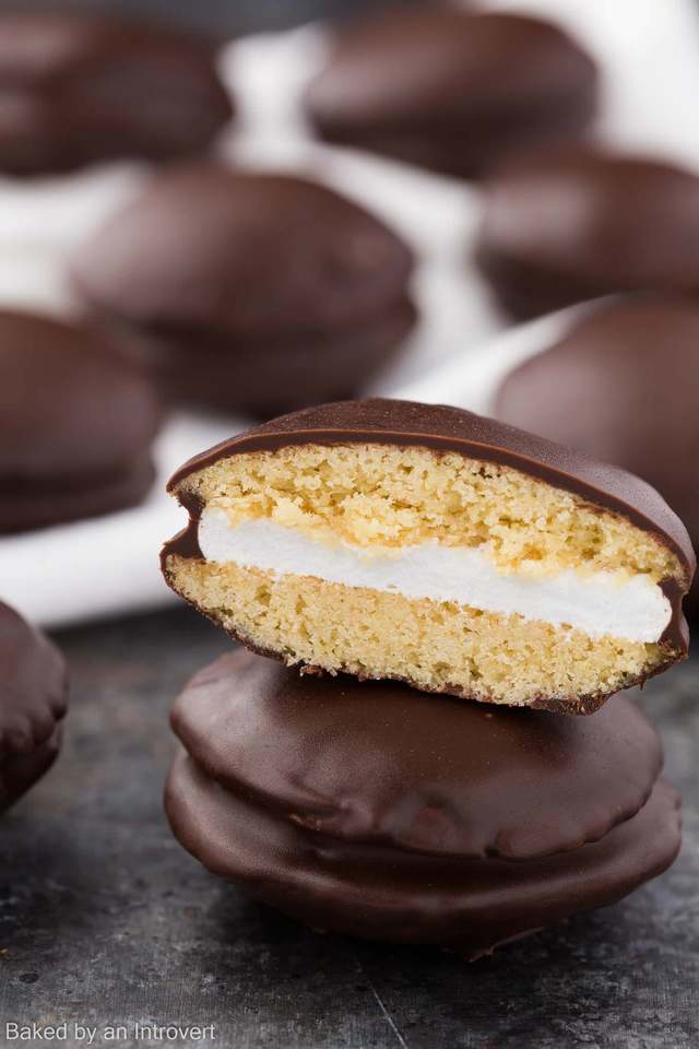 Half a moon pie stacked on top of a whole cookie.