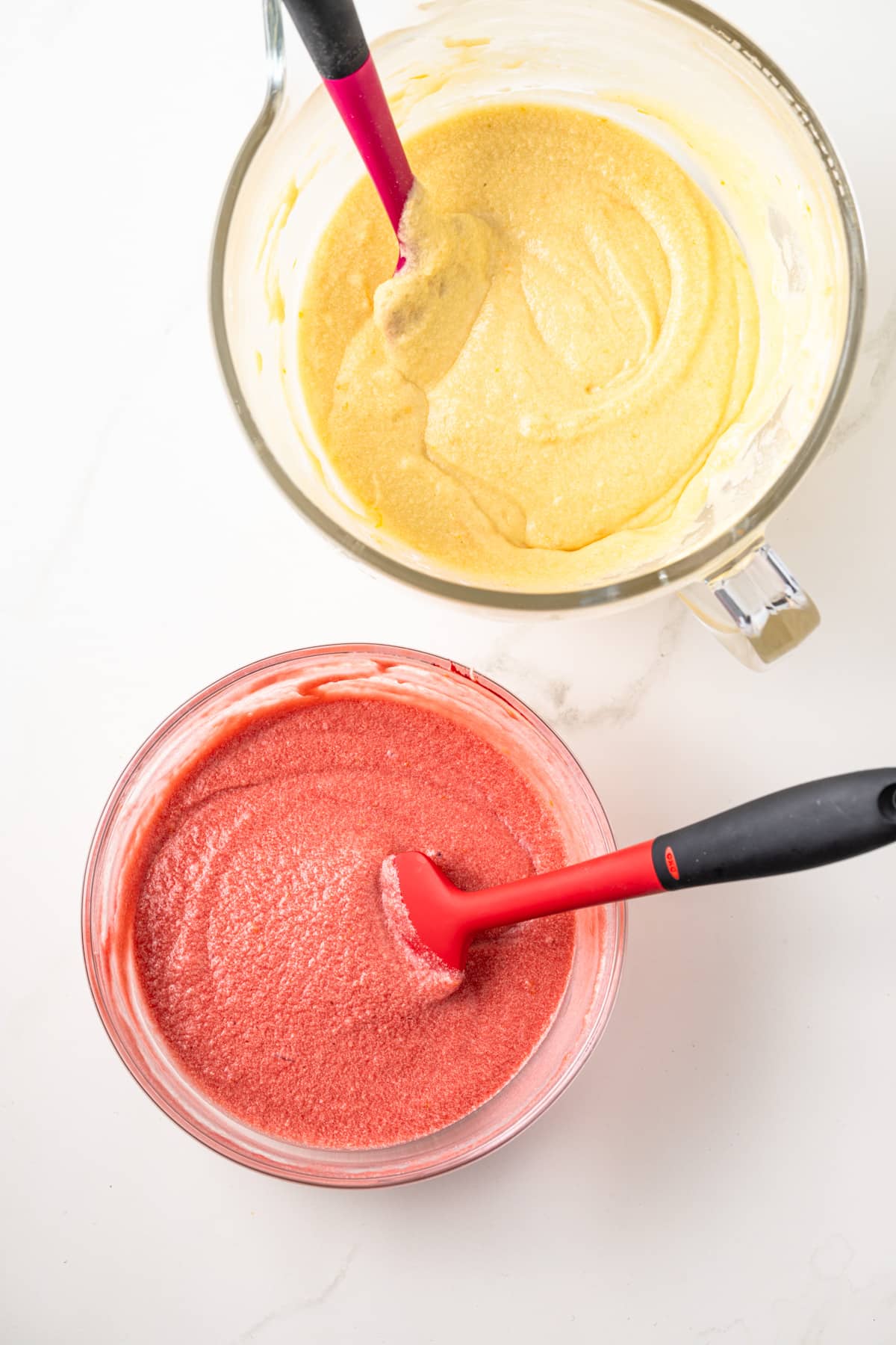 Cake batter divided into two colors.