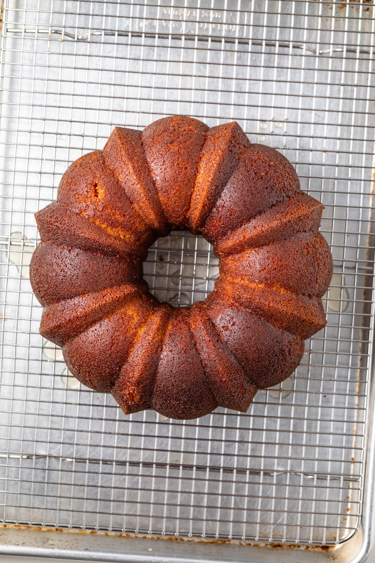 Overhead of tequila sunrise cake on a wire rack.