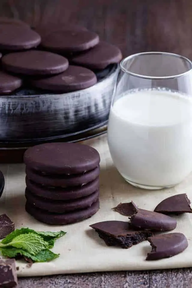 A stack of homemade thin mints and a glass of milk.