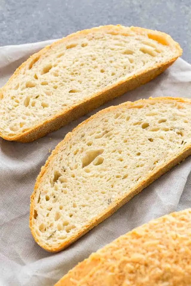 Angled view of two slices of Rosemary Cheese Bread