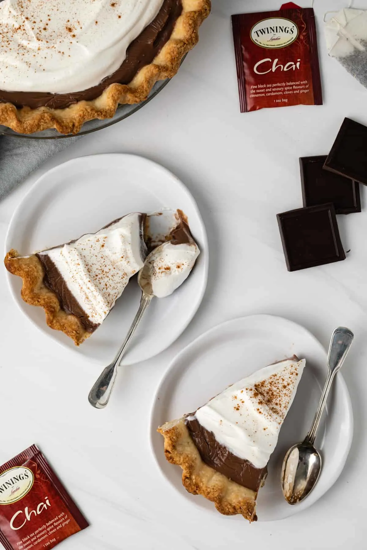 Overview view of two plates of chocolate chai cream pie