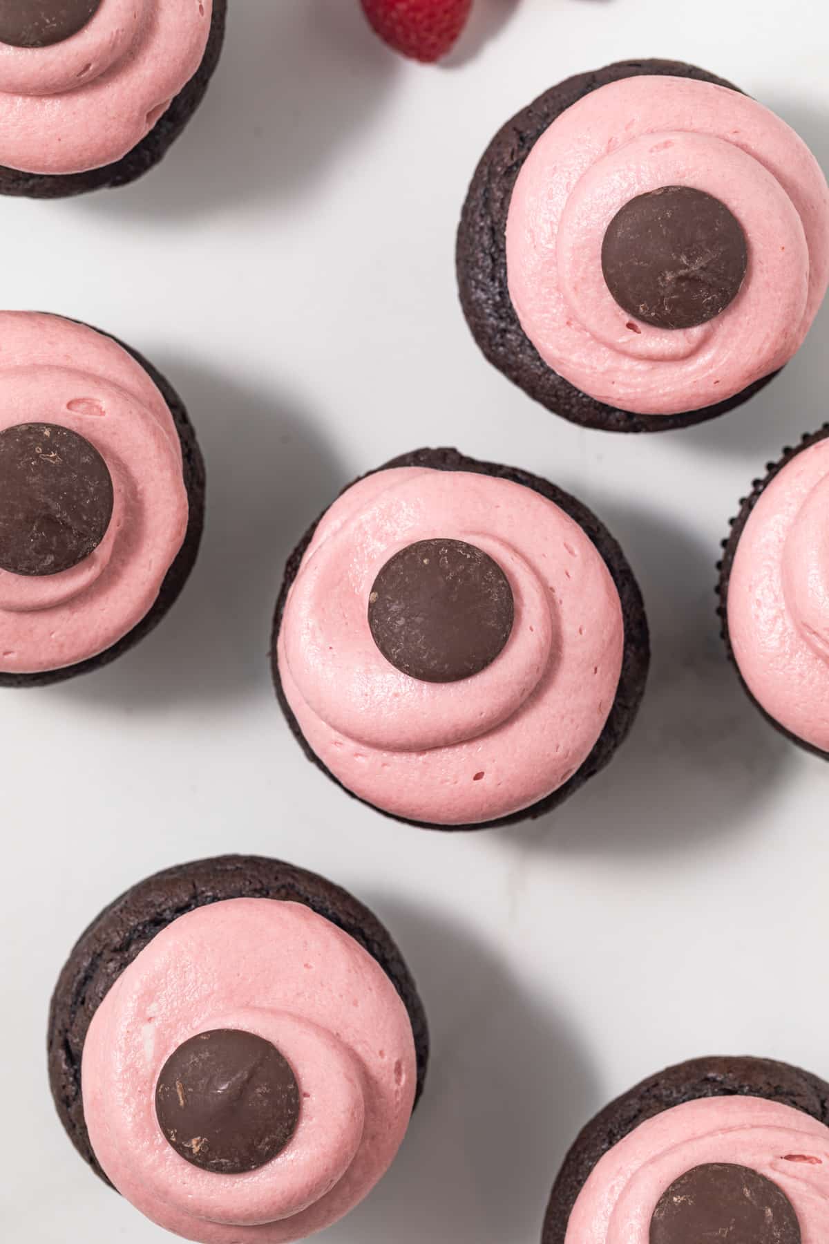 Overhead of chocolate raspberry cupcakes.