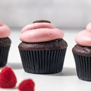 Side view of chocolate raspberry cupcakes.