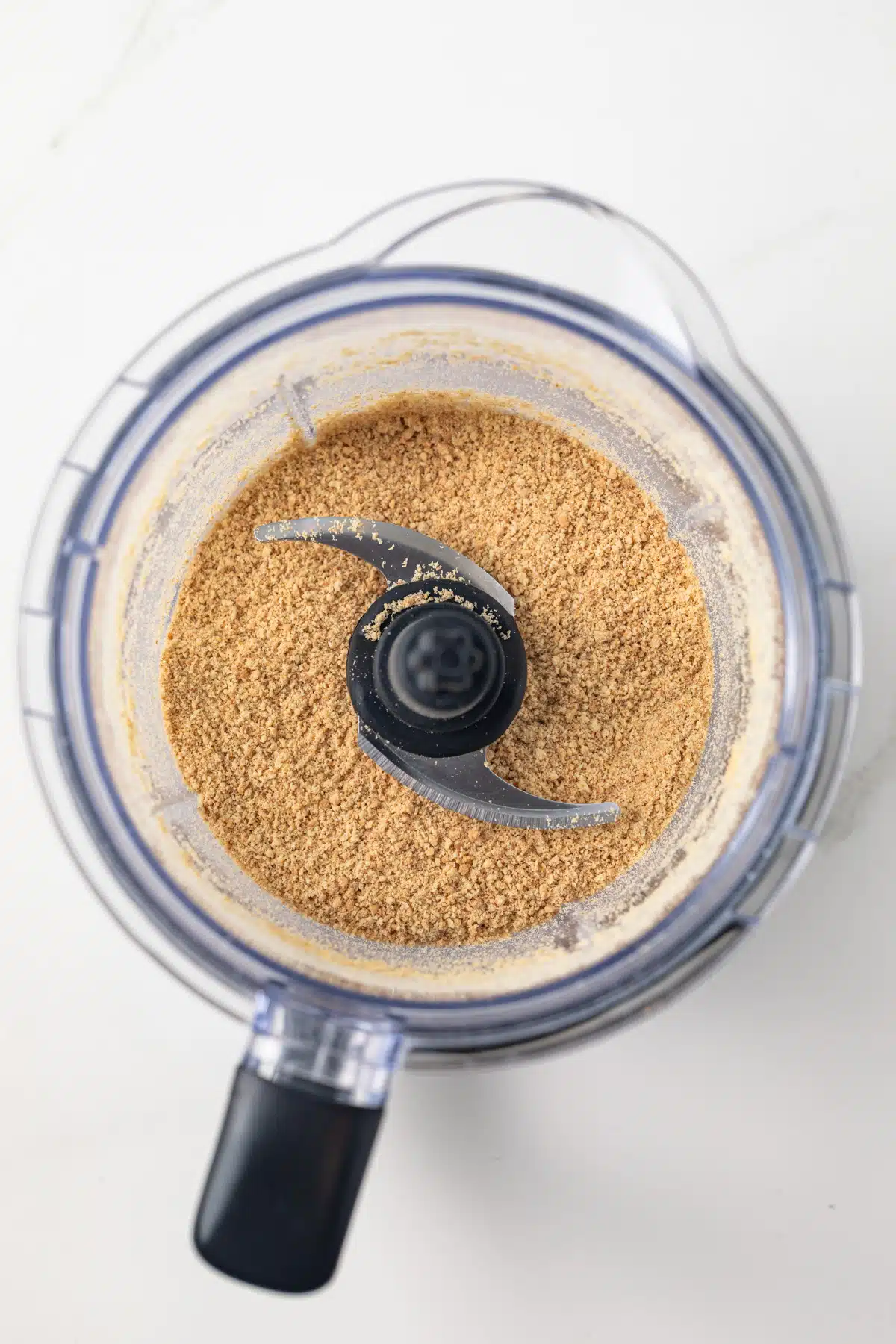 Graham cracker crumbs in a food processor.