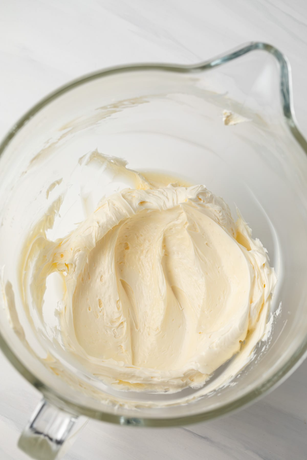 Creamed butter in a glass bowl.