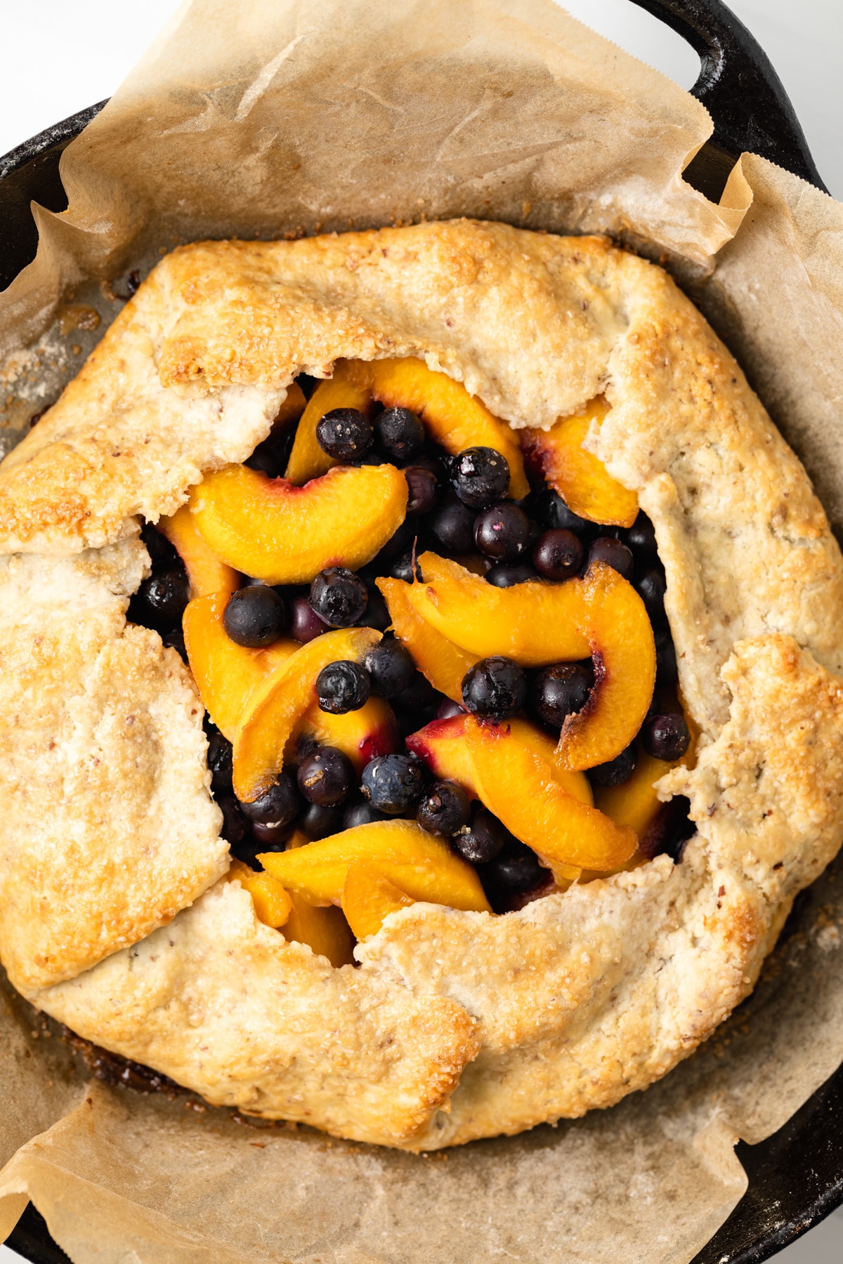 Close up of peach blueberry galette.