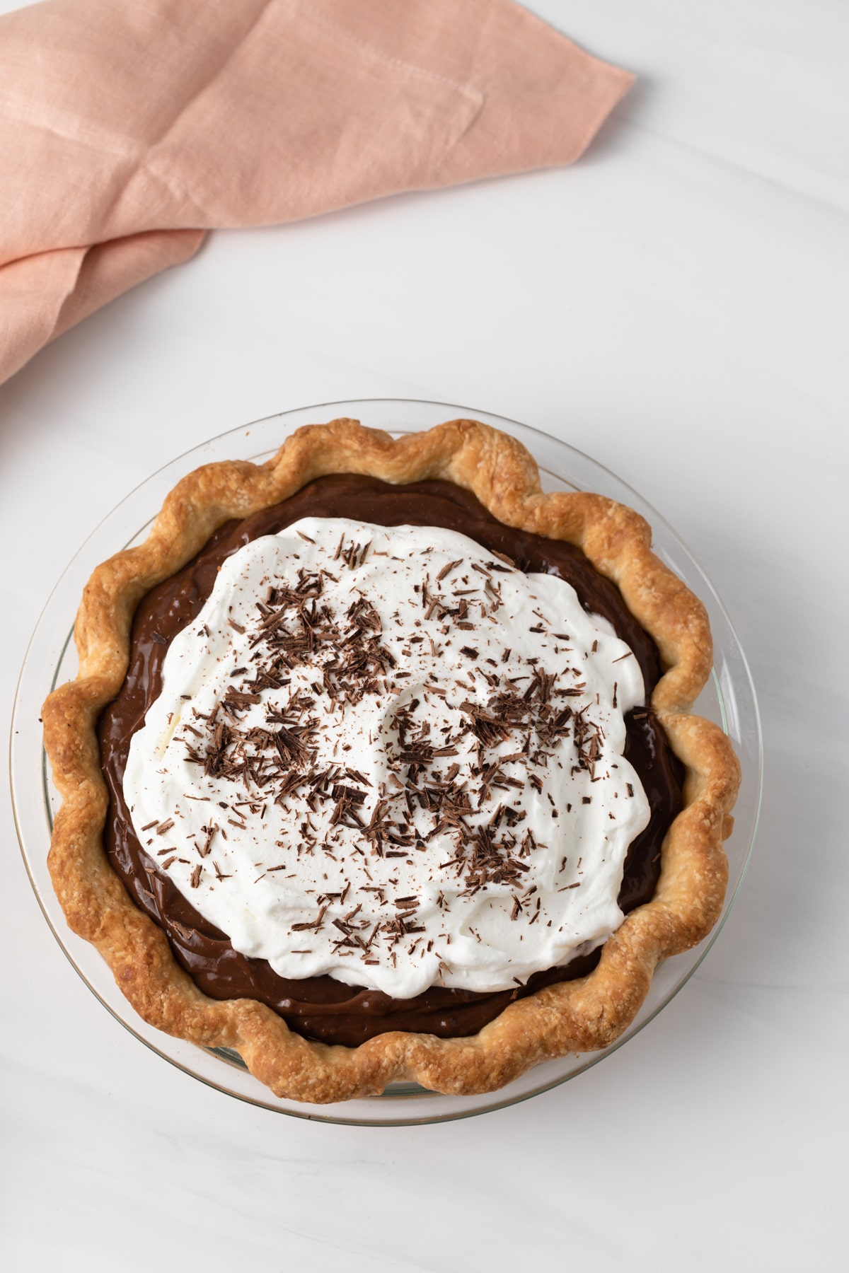 overhead of chocolate pie with whipped cream in a homemade pie crust