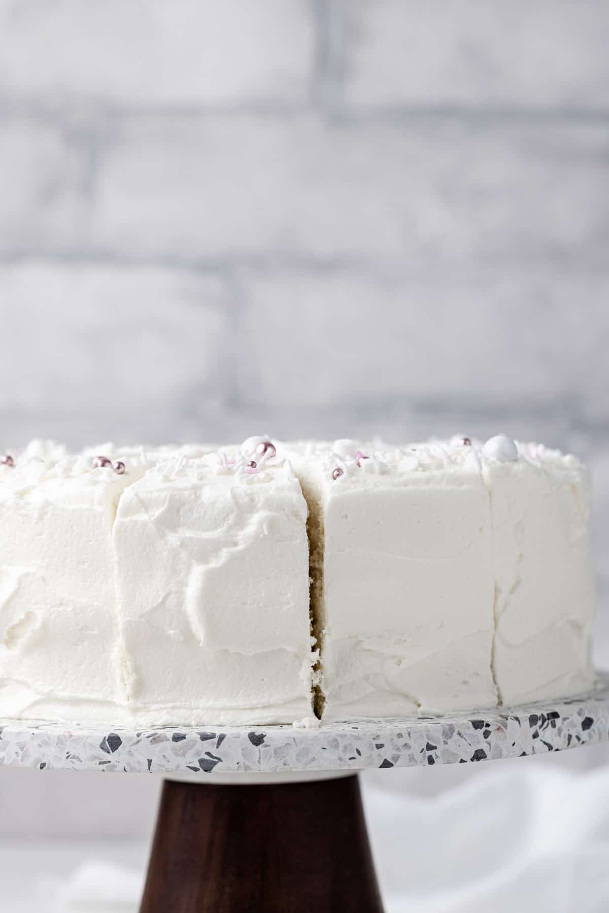 Side view of a frosted moist white cake