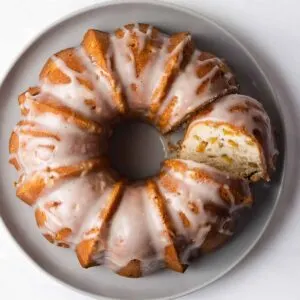 A peach pound cake with glaze over the top