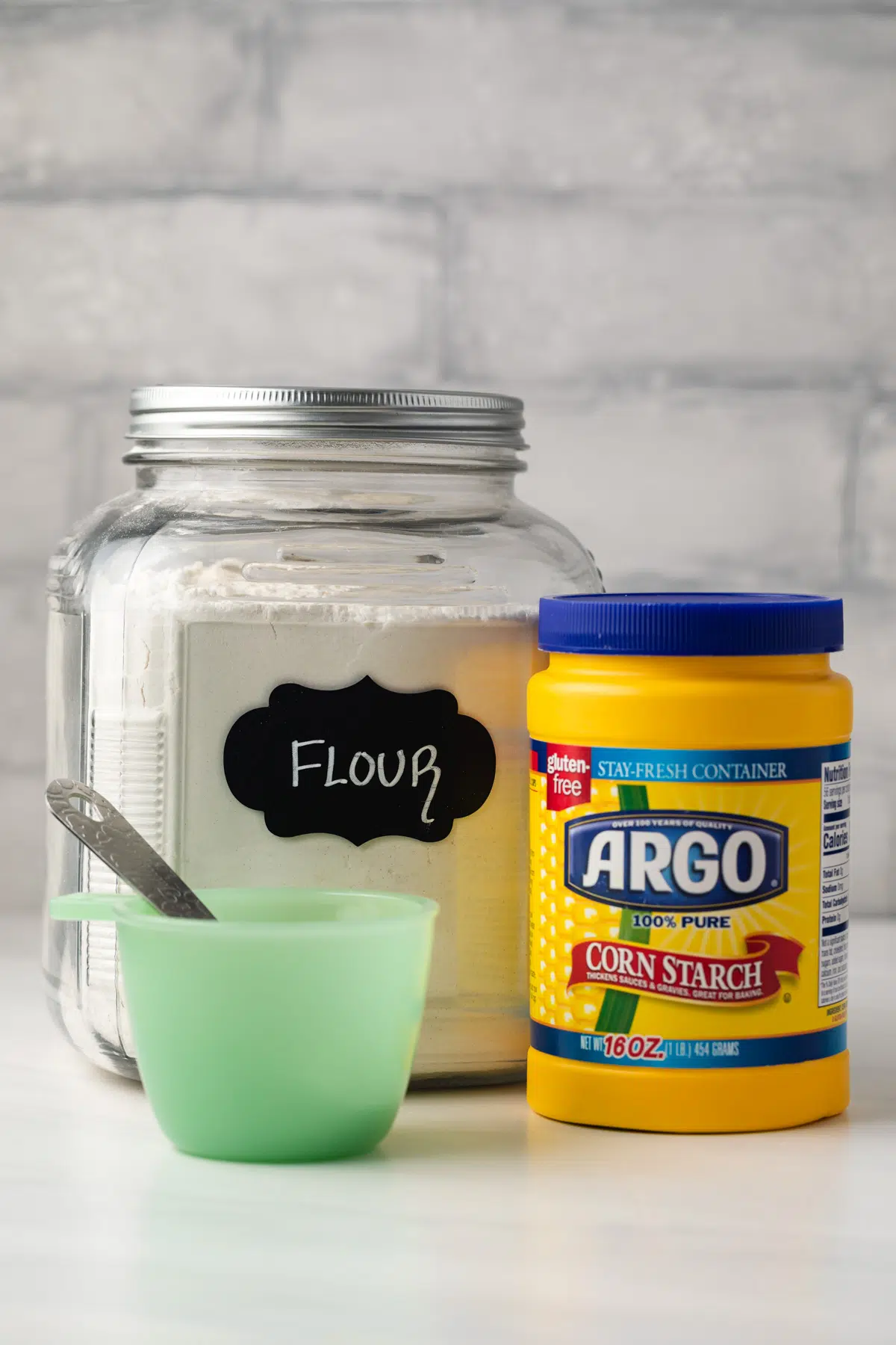 Flour, cornstarch, and measuring cup.