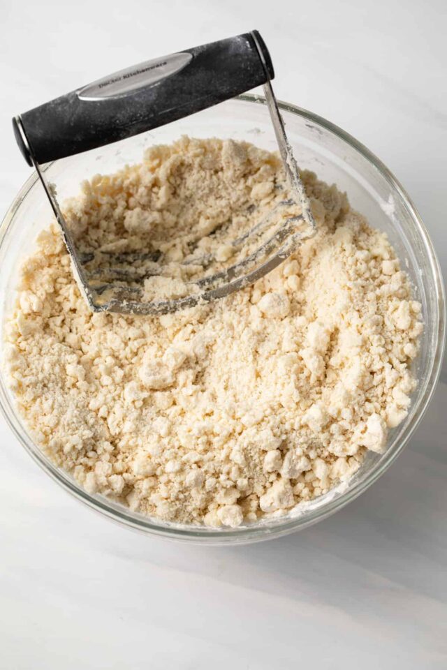 Butter being cut into shortbread dough