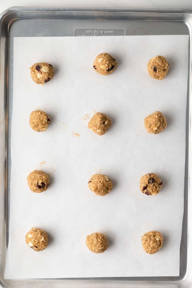Oatmeal cookie dough balls on a baking sheet
