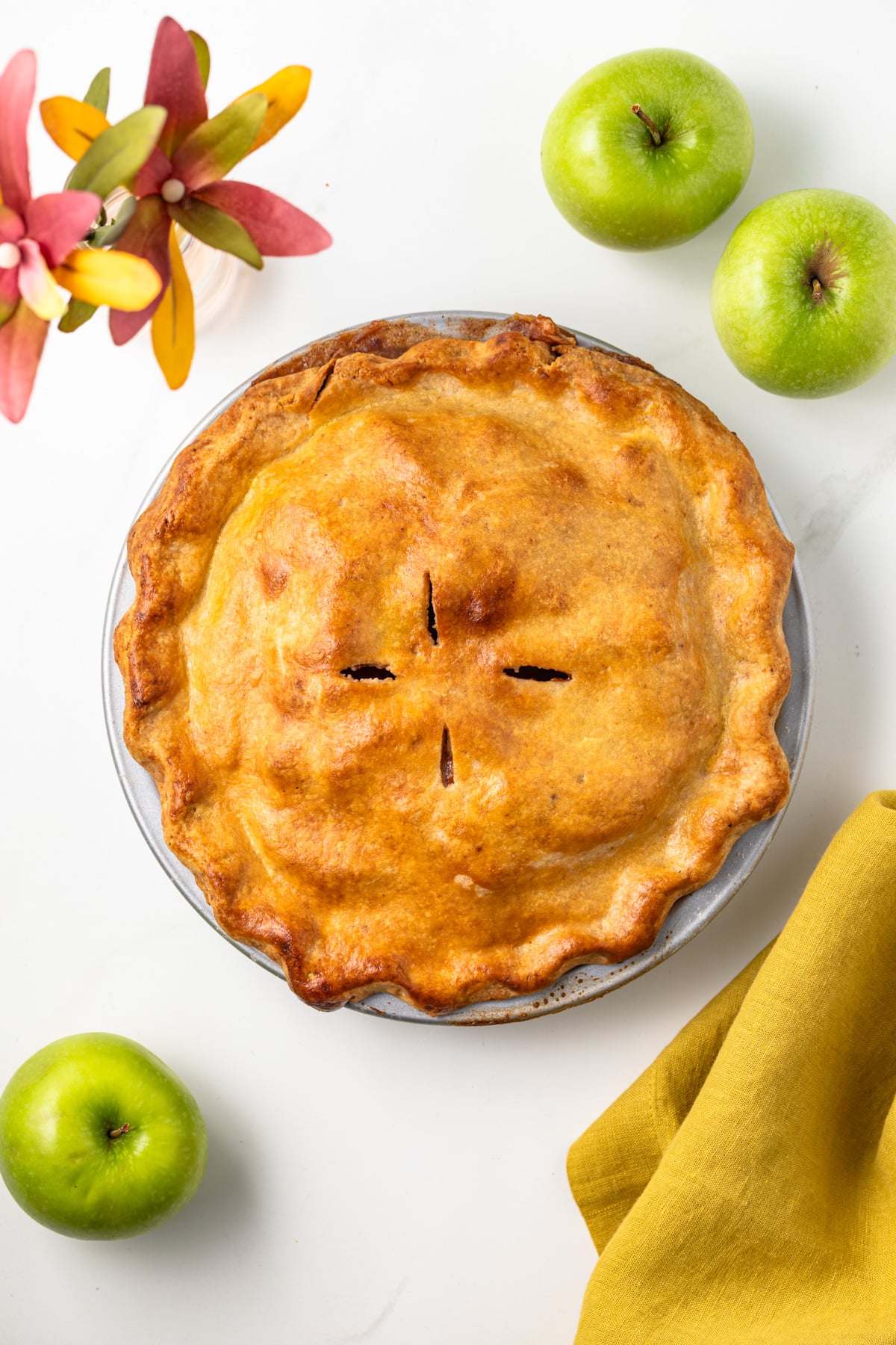 Overhead view of apple pie with brown butter crust.