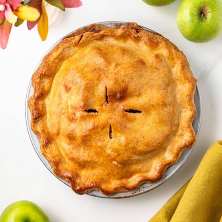 Overhead view of apple pie with brown butter crust.