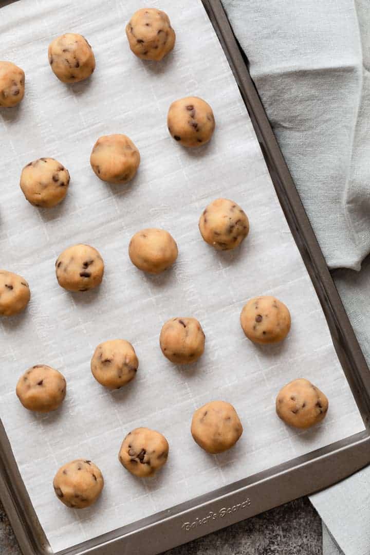 edible cookie dough balls on a baking sheet