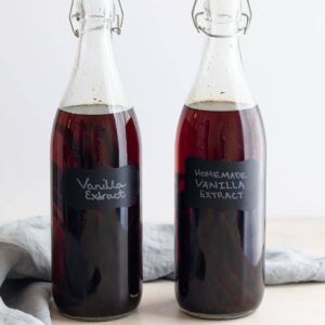 homemade vanilla extract in clear glass jars