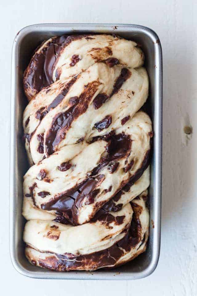 Unbaked Chocolate Cherry Swirl Bread in a pan