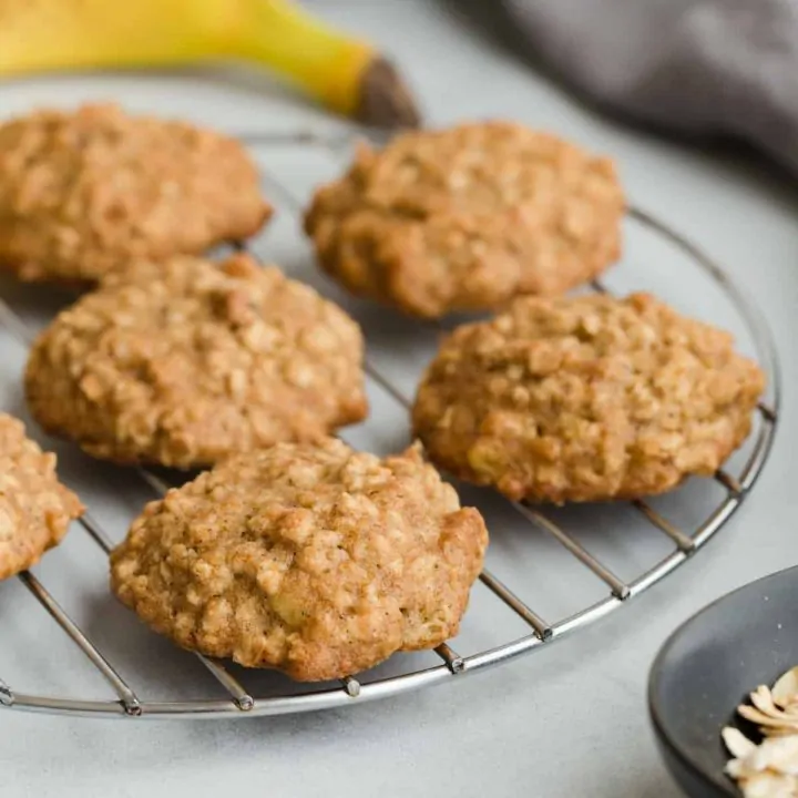 banana oatmeal cookies on a round wire cooling rack.