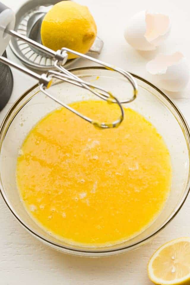 bowl of lemon curd with hand mixer to the side