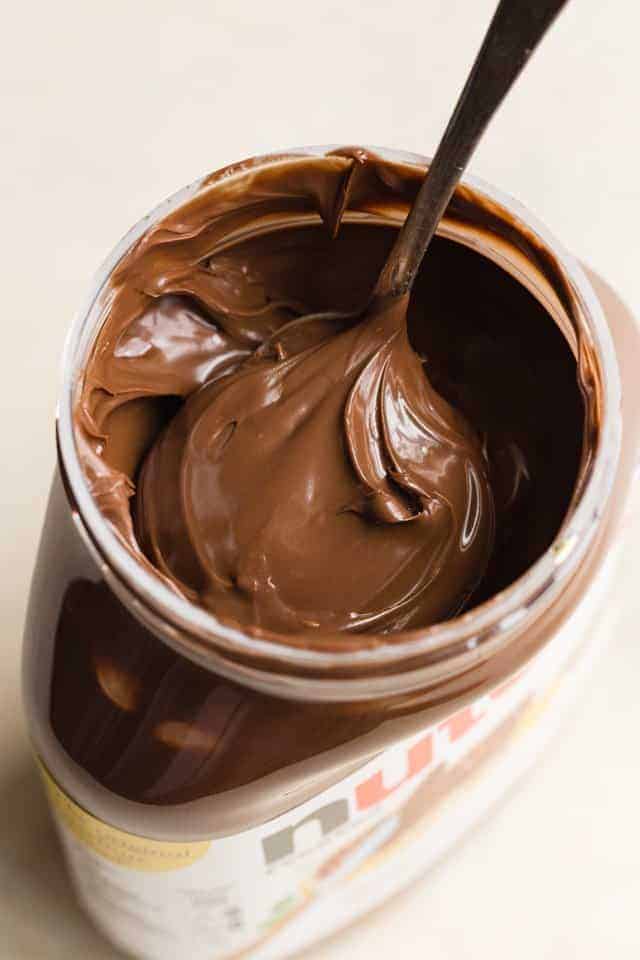 Jar of Nutella with spoon inside
