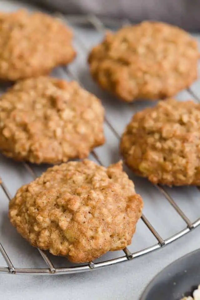 Close view of oatmeal banana cookies on wire rack.