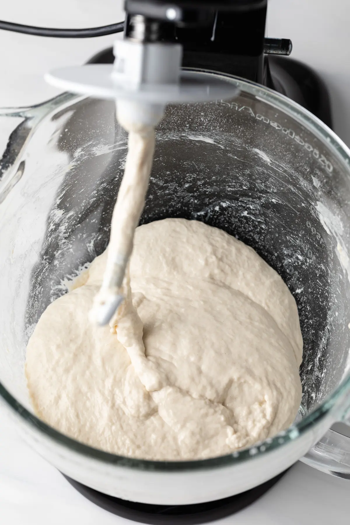 loose, batter-like dough in bowl of stand mixer fitted with dough hook