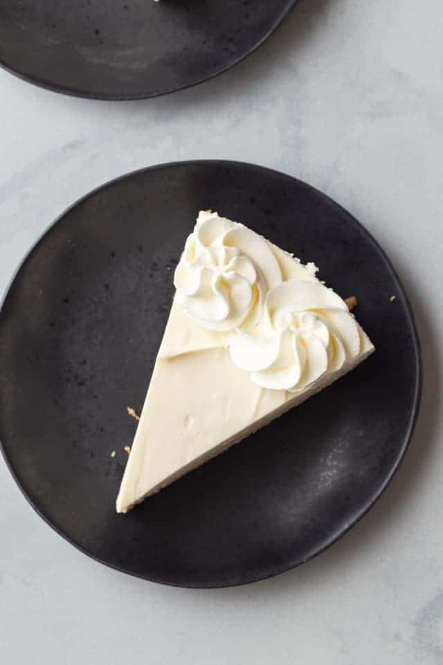 easy no bake cheesecake slice on a navy blue plate