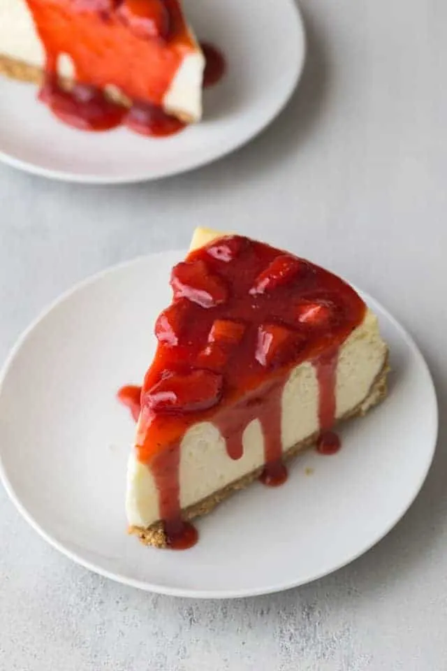 strawberry cheesecake on white plate