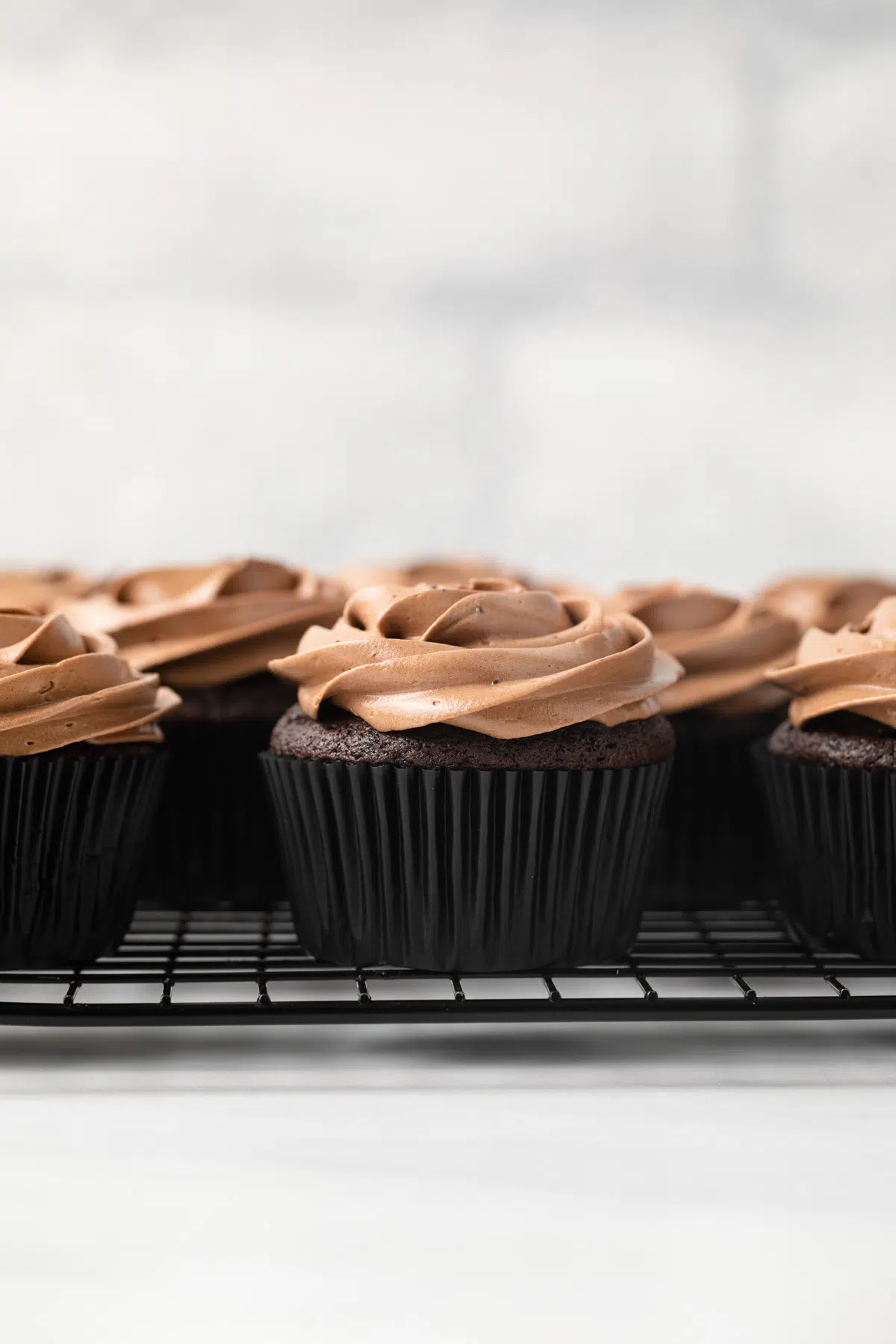 Homemade Chocolate Cupcakes on a black wire rack