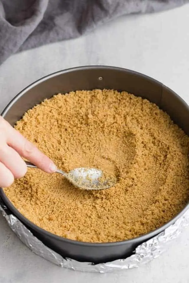 Graham cracker crust pressed into pan with spoon.