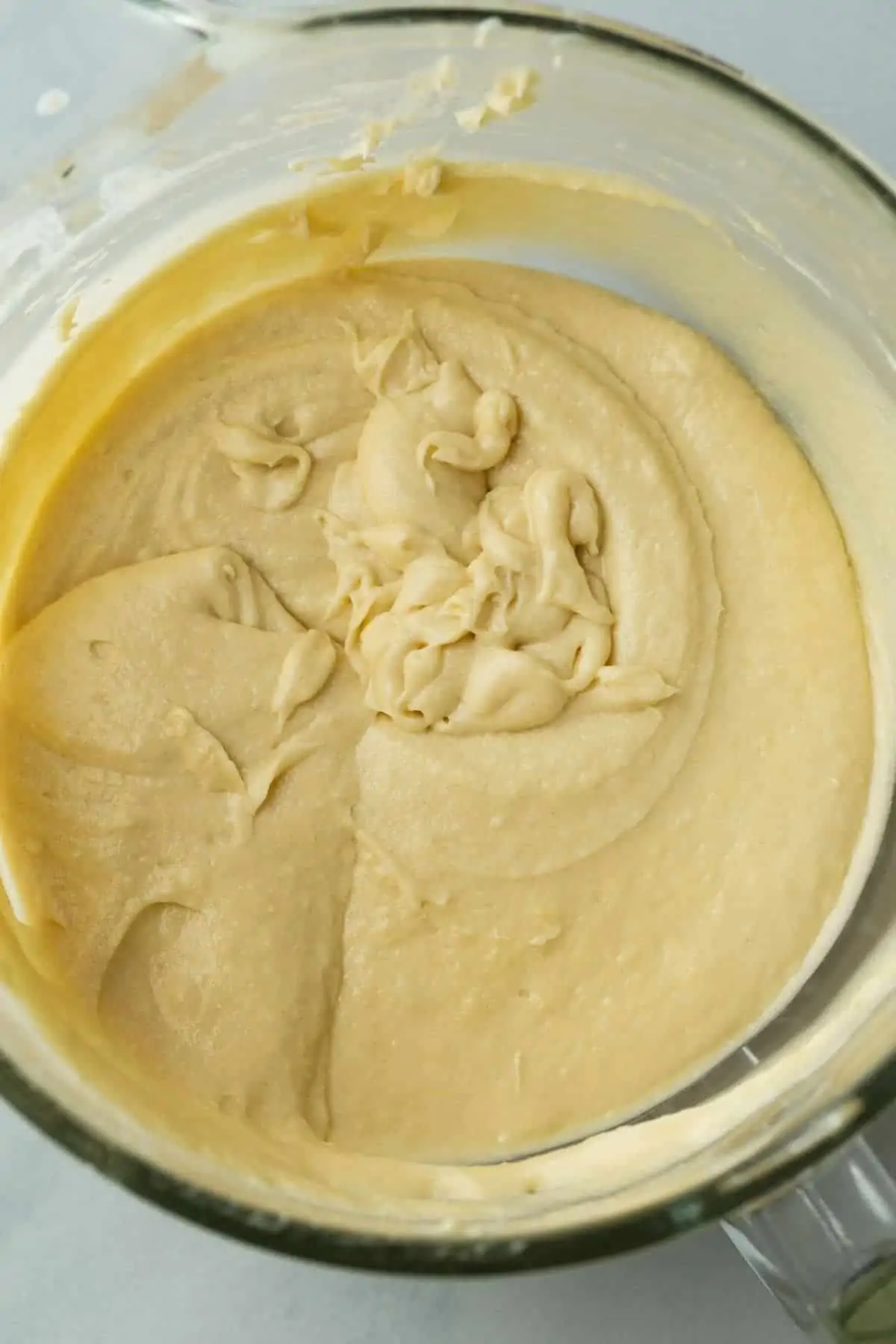 Cake batter in a glass mixing bowl.