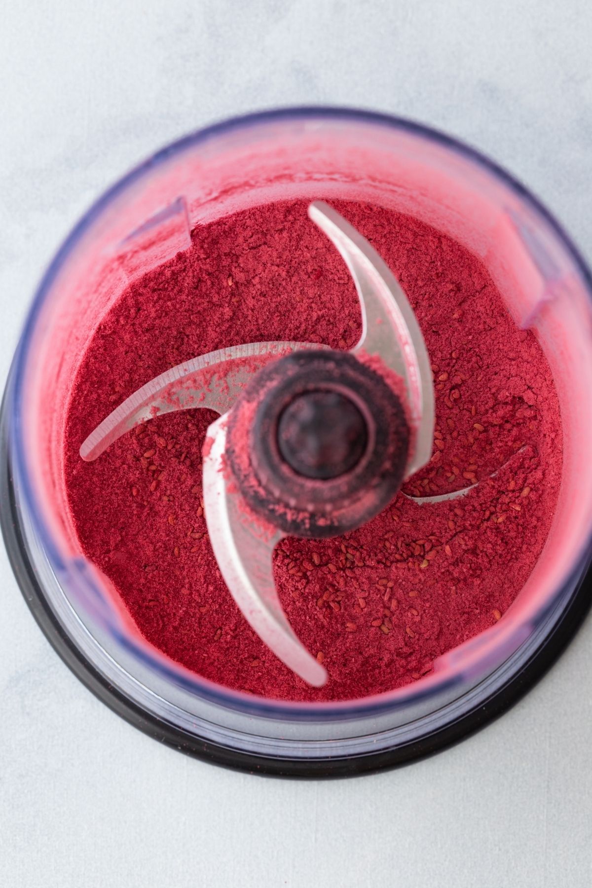 ground freeze-dried raspberries in a food processor