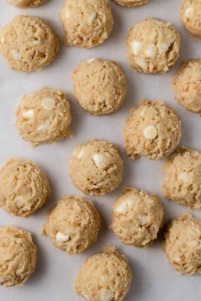 White chocolate chip cookie dough balls ready to be baked