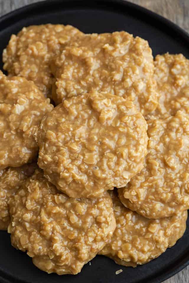 Overhead view of cookie butter no bake cookies on a black plate