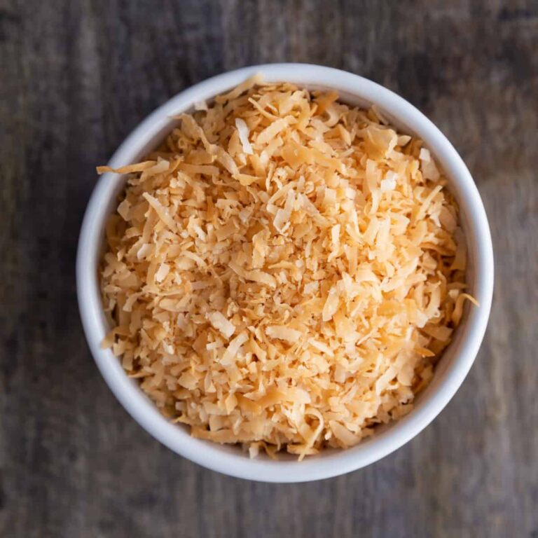 microwave toasted coconut in a white bowl