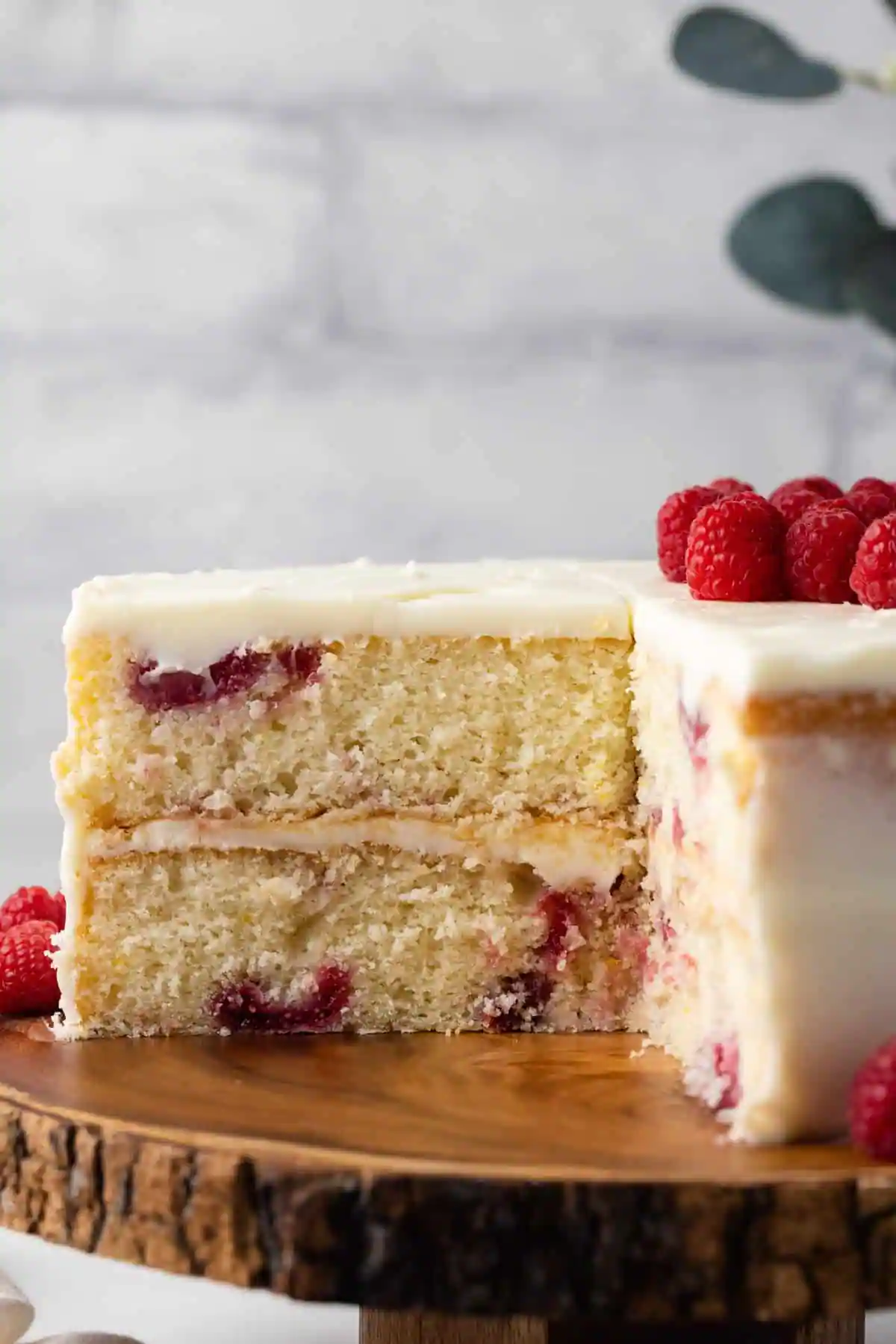 Lemon raspberry cake with a slice cut out