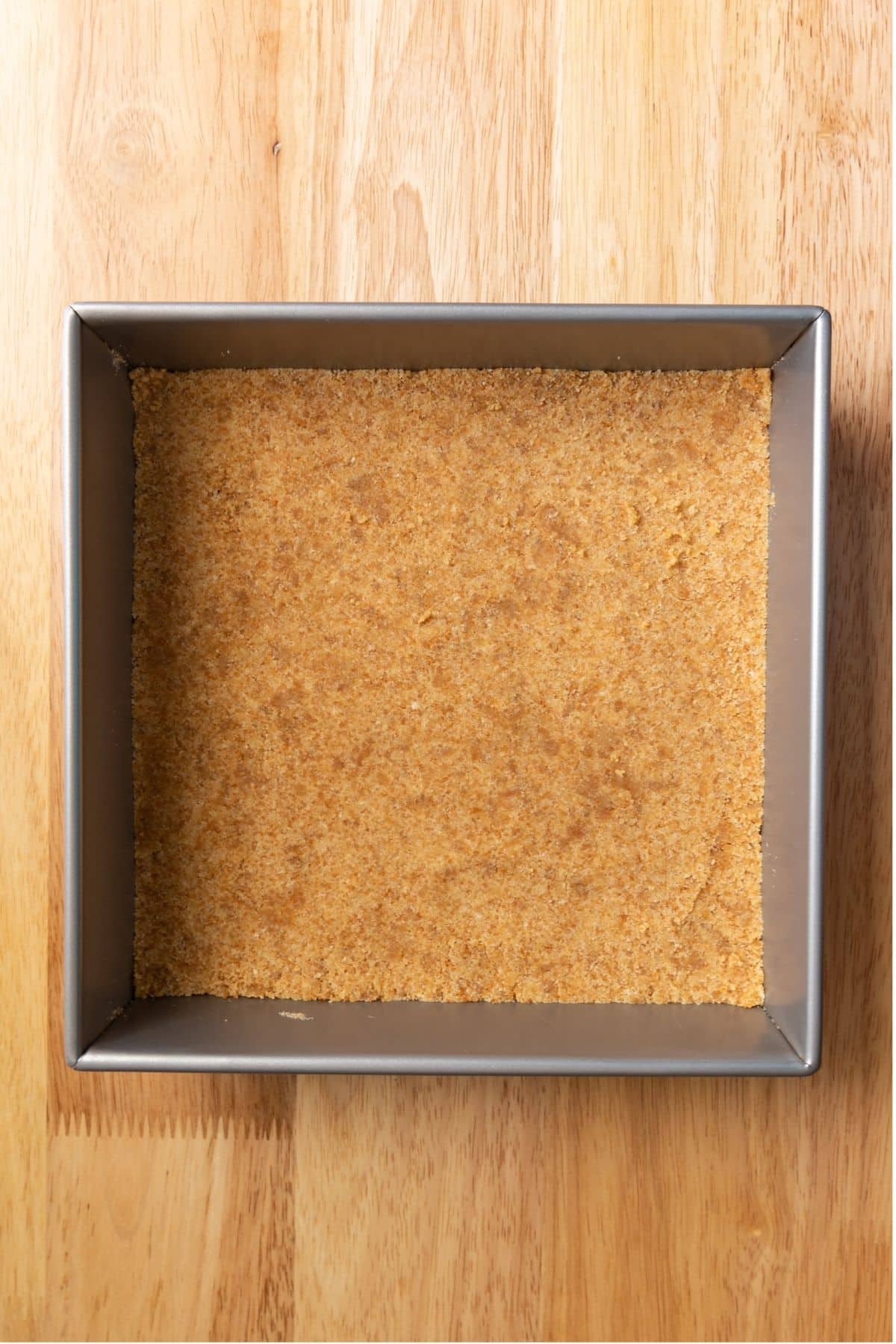 Graham cracker crumbs pressed in square pan.